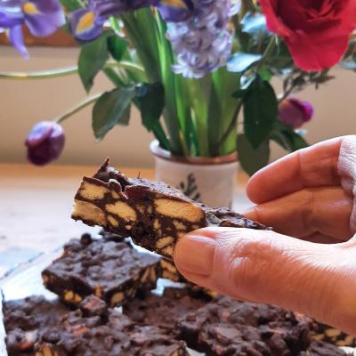 Dark chocolate rocky road with biscuits and vegan marshmallows inside.